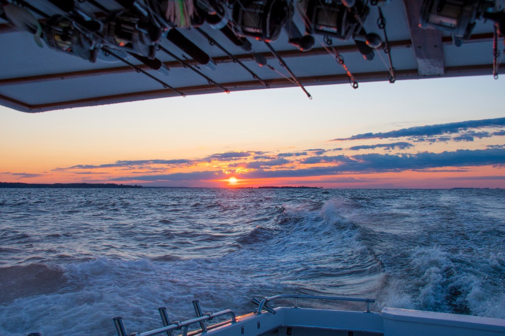 Sportfisher running offshore at sunset