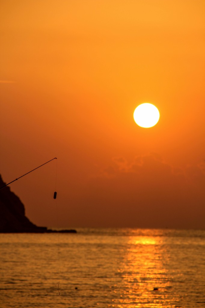 Golden-hour sunset fishing on the water